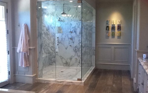 Bookmatched slab marble shower and countertops